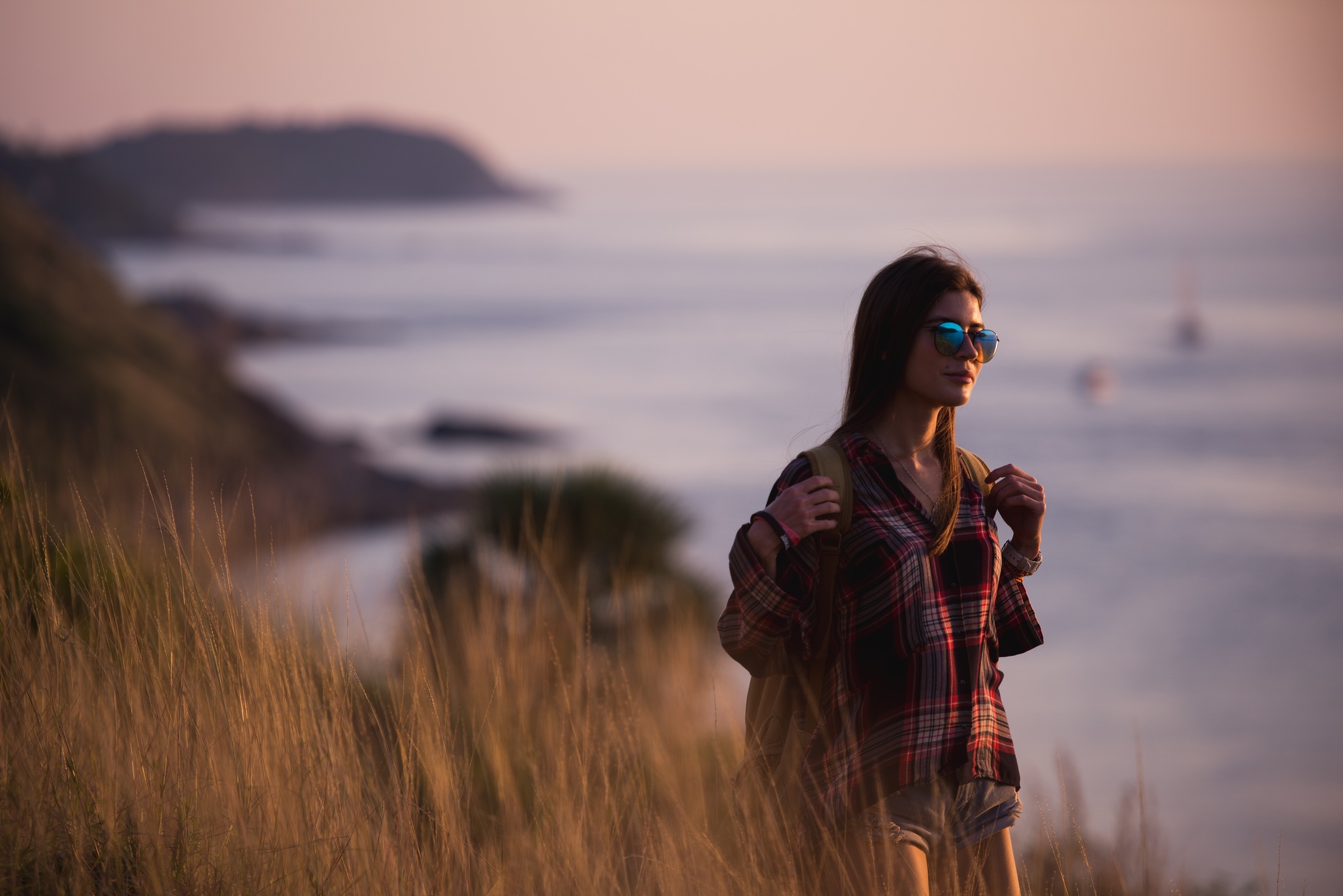 young freedom woman enjoy ocean sunset on mountain peak