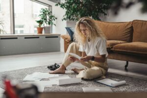 Woman organizing questions with a divorce coach before contacting her attorney